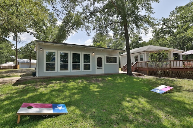 20559 Red Bud Ct, Thornton, TX 76687 - rear view of property with a wooden deck and a lawn