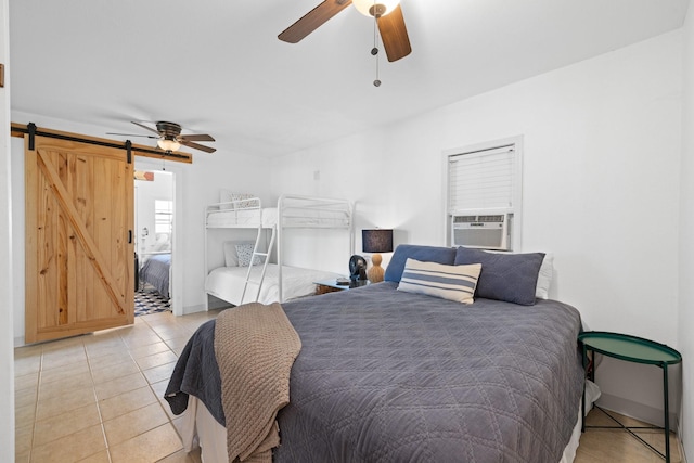 20559 Red Bud Ct, Thornton, TX 76687 - bedroom with a barn door, cooling unit, light tile patterned flooring, and a ceiling fan