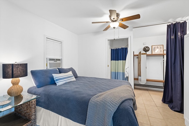 20559 Red Bud Ct, Thornton, TX 76687 - bedroom featuring cooling unit, light tile patterned floors, a baseboard radiator, and ceiling fan