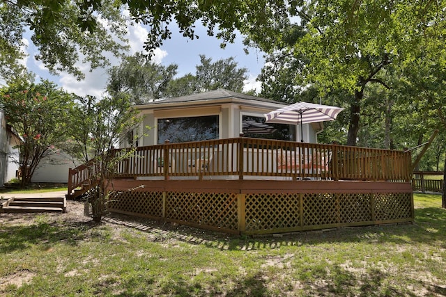 20559 Red Bud Ct, Thornton, TX 76687 - back of house with a wooden deck and a yard
