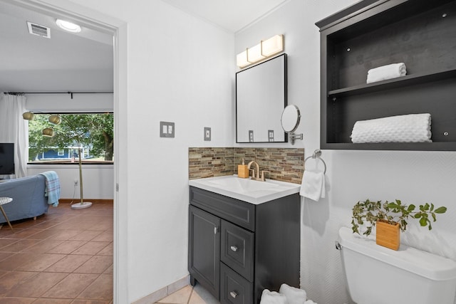 20559 Red Bud Ct, Thornton, TX 76687 - bathroom featuring vanity, decorative backsplash, and tile patterned flooring