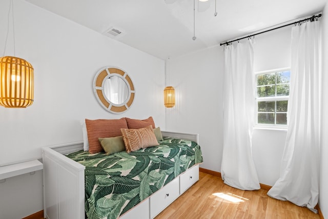 20559 Red Bud Ct, Thornton, TX 76687 - bedroom featuring light wood-type flooring and a ceiling fan