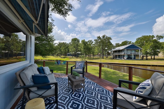 20559 Red Bud Ct, Thornton, TX 76687 - deck featuring a water view, a lawn, and view of wooded area