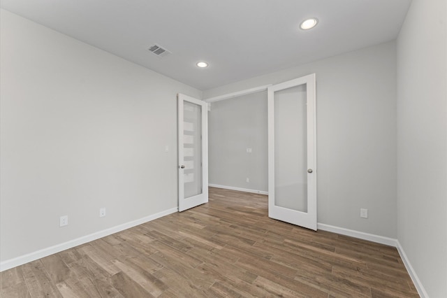 29622 Sterling Knoll Dr, Fulshear, TX 77441 - unfurnished bedroom featuring wood finished floors, recessed lighting, and french doors