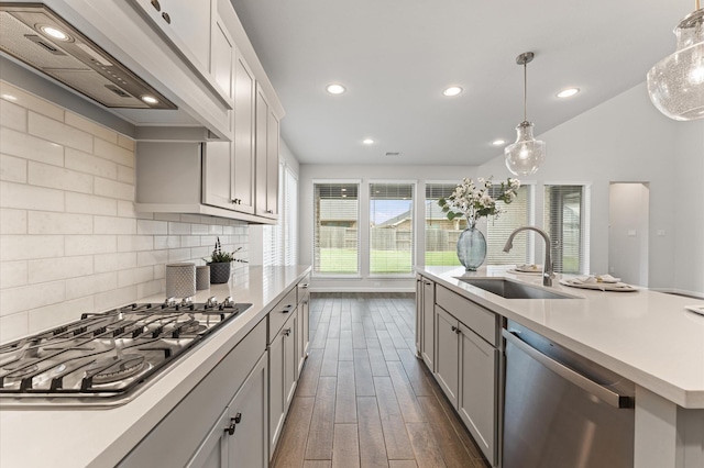 29622 Sterling Knoll Dr, Fulshear, TX 77441 - kitchen with appliances with stainless steel finishes, range hood, recessed lighting, light countertops, and gray cabinets