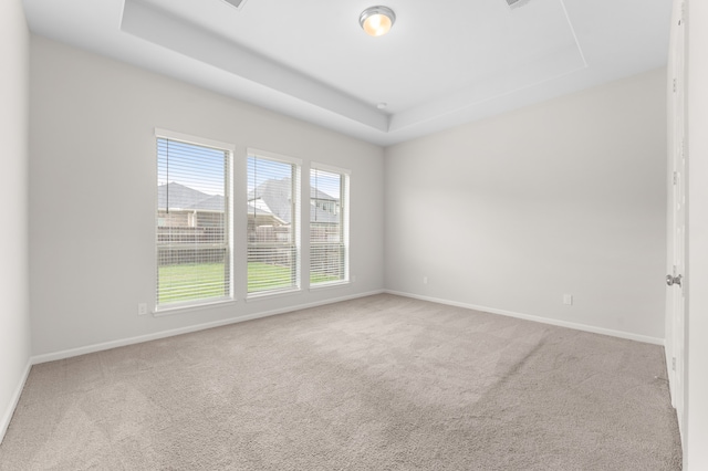29622 Sterling Knoll Dr, Fulshear, TX 77441 - carpeted empty room with a tray ceiling and baseboards