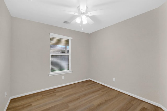 10143 Rose Willow Ln, Brookshire, TX 77423 - empty room featuring wood finished floors and ceiling fan