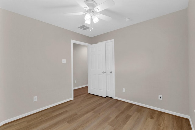 10143 Rose Willow Ln, Brookshire, TX 77423 - unfurnished bedroom with light wood-style flooring, ceiling fan, and a closet