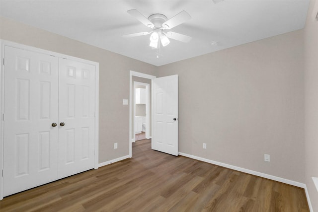 10143 Rose Willow Ln, Brookshire, TX 77423 - unfurnished bedroom featuring wood finished floors, a closet, and a ceiling fan