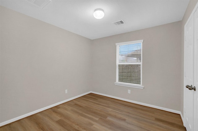 10143 Rose Willow Ln, Brookshire, TX 77423 - spare room with wood finished floors