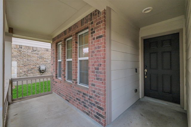 10143 Rose Willow Ln, Brookshire, TX 77423 - property entrance with a porch and brick siding