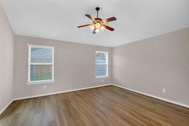 10143 Rose Willow Ln, Brookshire, TX 77423 - spare room featuring plenty of natural light, wood finished floors, and ceiling fan