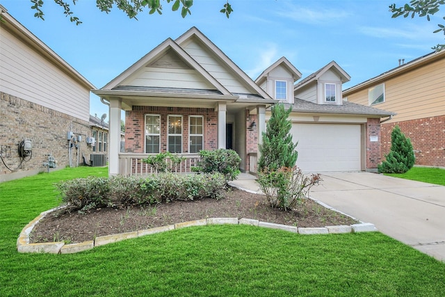 10143 Rose Willow Ln, Brookshire, TX 77423 - view of front facade featuring brick siding, a porch, a front lawn, driveway, and a garage
