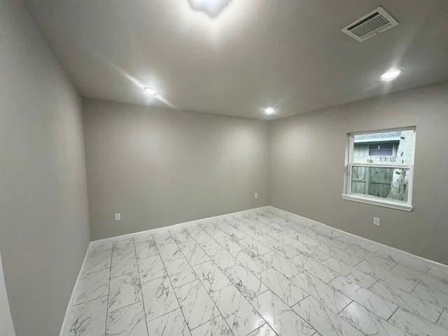 9013 Lugary Dr, Houston, TX 77074 - unfurnished room with marble look tile flooring and recessed lighting