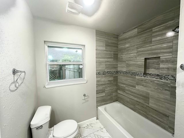9013 Lugary Dr, Houston, TX 77074 - full bath featuring marble finish floors and  shower combination