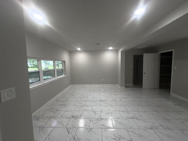 9013 Lugary Dr, Houston, TX 77074 - empty room with light marble finish floors and recessed lighting
