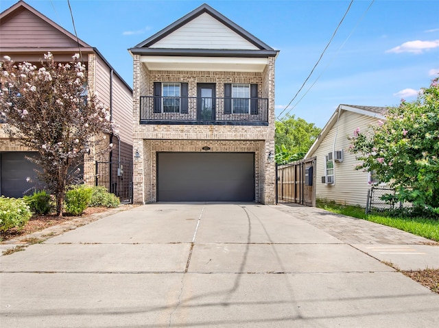 5406 Darling St Unit A, Houston, TX 77007 - view of front of house with brick siding, a balcony, driveway, a gate, and cooling unit