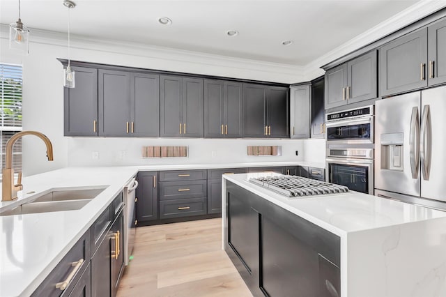 5406 Darling St Unit A, Houston, TX 77007 - kitchen featuring stainless steel appliances, light stone countertops, light wood-style floors, pendant lighting, and ornamental molding