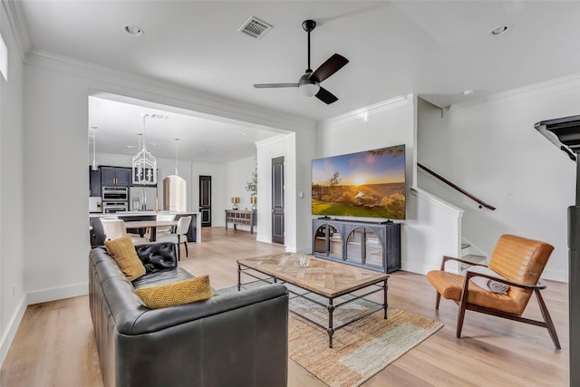 5406 Darling St Unit A, Houston, TX 77007 - living area with ornamental molding, ceiling fan, light wood finished floors, stairway, and recessed lighting