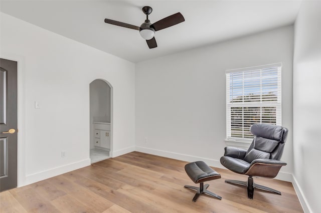5406 Darling St Unit A, Houston, TX 77007 - living area featuring arched walkways, ceiling fan, and light wood finished floors