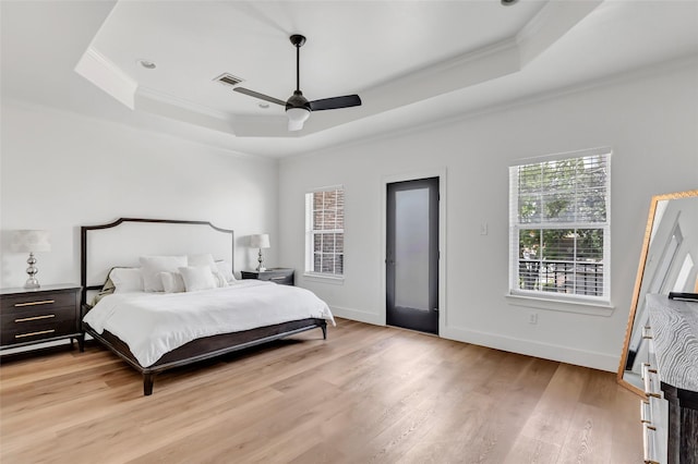 5406 Darling St Unit A, Houston, TX 77007 - bedroom featuring a raised ceiling, crown molding, light wood-type flooring, and ceiling fan