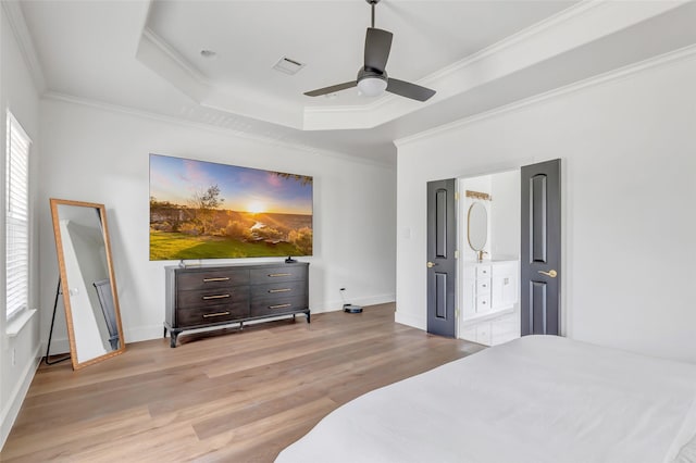 5406 Darling St Unit A, Houston, TX 77007 - bedroom featuring ornamental molding, light wood-type flooring, a tray ceiling, a ceiling fan, and ensuite bath