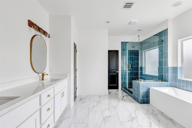 5406 Darling St Unit A, Houston, TX 77007 - bathroom with a stall shower, a garden tub, double vanity, and marble finish flooring