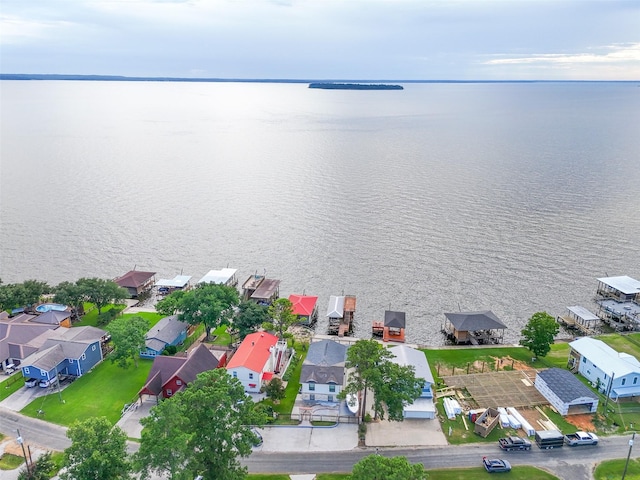 374 W Lake Shore Dr, Livingston, TX 77351 - aerial perspective of suburban area with a nearby body of water