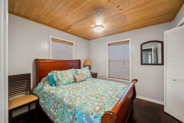 374 W Lake Shore Dr, Livingston, TX 77351 - bedroom with dark wood-type flooring and wooden ceiling