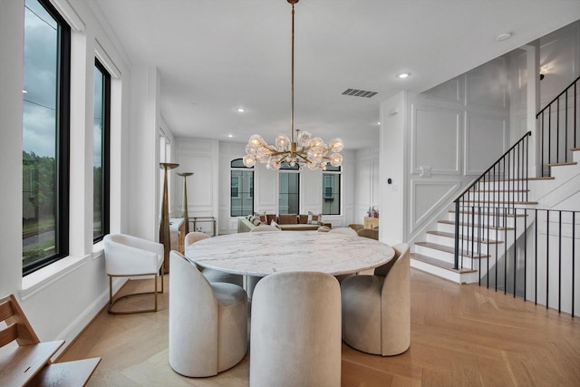3502 Dorset Cliff Ln, Houston, TX 77055 - dining area featuring stairway, a chandelier, recessed lighting, and a decorative wall