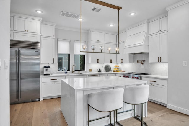 3502 Dorset Cliff Ln, Houston, TX 77055 - kitchen with stainless steel appliances, white cabinetry, tasteful backsplash, light countertops, and recessed lighting