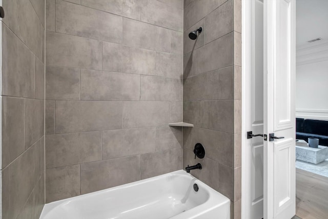 3502 Dorset Cliff Ln, Houston, TX 77055 - bathroom with crown molding, shower / bathtub combination, and wood finished floors