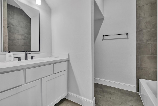 3502 Dorset Cliff Ln, Houston, TX 77055 - full bathroom with vanity, a tub, and tile patterned flooring