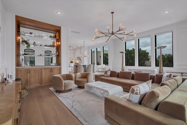 3502 Dorset Cliff Ln, Houston, TX 77055 - living room with a chandelier, wood finished floors, and recessed lighting