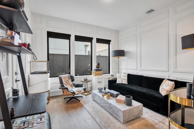 3502 Dorset Cliff Ln, Houston, TX 77055 - living room with a decorative wall and wood-type flooring