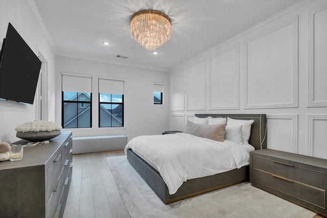 3502 Dorset Cliff Ln, Houston, TX 77055 - bedroom with a chandelier, light wood-type flooring, a decorative wall, crown molding, and recessed lighting