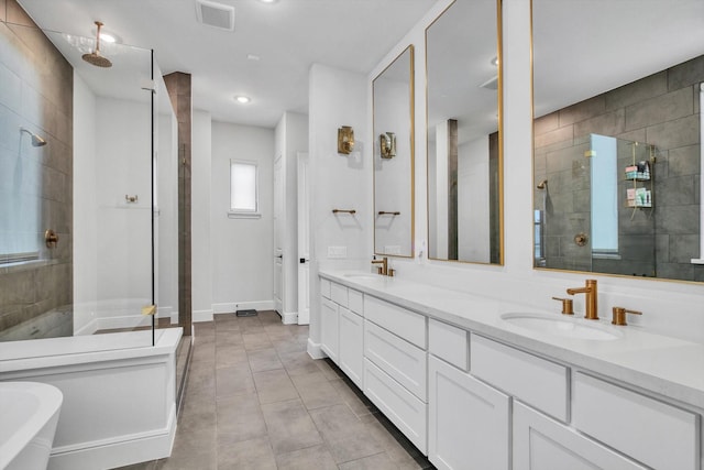 3502 Dorset Cliff Ln, Houston, TX 77055 - bathroom featuring a stall shower, double vanity, a freestanding bath, and tile patterned flooring