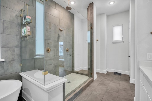 3502 Dorset Cliff Ln, Houston, TX 77055 - bathroom with a shower stall, a freestanding tub, vanity, recessed lighting, and tile patterned floors