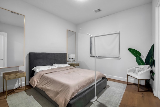 3502 Dorset Cliff Ln, Houston, TX 77055 - bedroom featuring wood finished floors and baseboards
