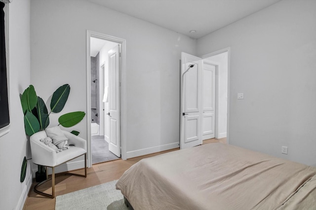3502 Dorset Cliff Ln, Houston, TX 77055 - bedroom with light wood-style flooring and baseboards