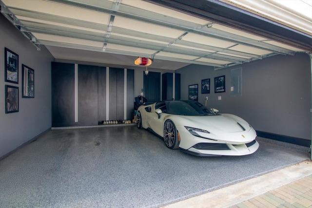 3502 Dorset Cliff Ln, Houston, TX 77055 - garage with a garage door opener and baseboards