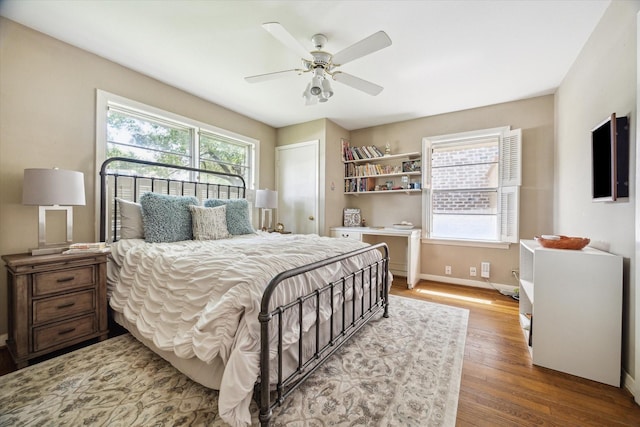 6249 Piping Rock Ln, Houston, TX 77057 - bedroom featuring wood finished floors and a ceiling fan
