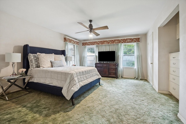 6249 Piping Rock Ln, Houston, TX 77057 - bedroom with light colored carpet and a ceiling fan