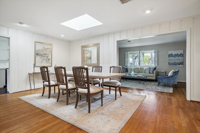 6249 Piping Rock Ln, Houston, TX 77057 - dining space with a skylight and wood finished floors