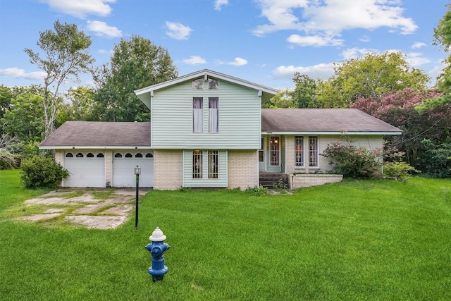 13922 Ambrose St, Houston, TX 77045 - split level home with an attached garage, a front lawn, and brick siding