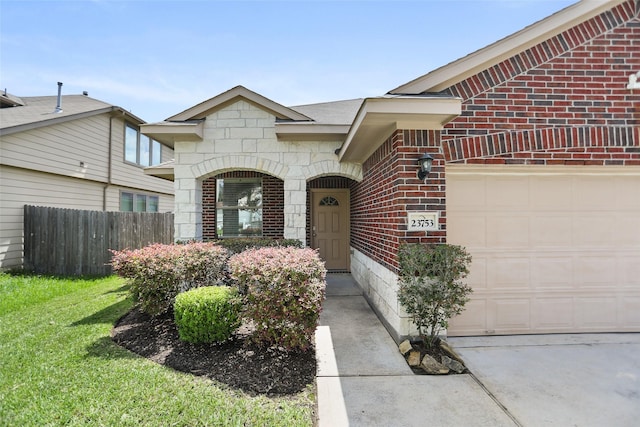 23753 Briar Tree Dr, Porter, TX 77365 - doorway to property with brick siding, a garage, and concrete driveway