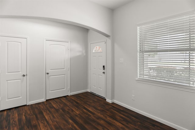 23753 Briar Tree Dr, Porter, TX 77365 - entrance foyer featuring arched walkways and dark wood-type flooring