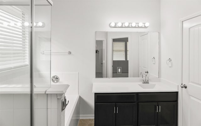 23753 Briar Tree Dr, Porter, TX 77365 - full bath featuring vanity, a garden tub, and a shower with shower door