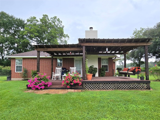 110 Red Bud St, Shepherd, TX 77371 - back of property featuring a pergola, a deck, a chimney, and brick siding