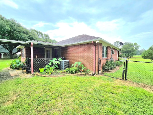 110 Red Bud St, Shepherd, TX 77371 - view of side of property featuring brick siding and a central air condition unit